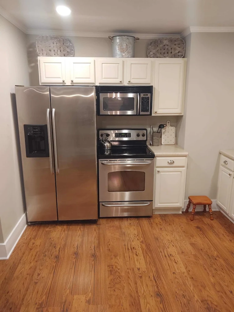 Kitchen cabinets being hand-painted in place