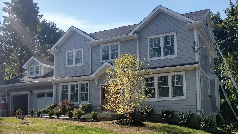House exterior with clean white and green trim