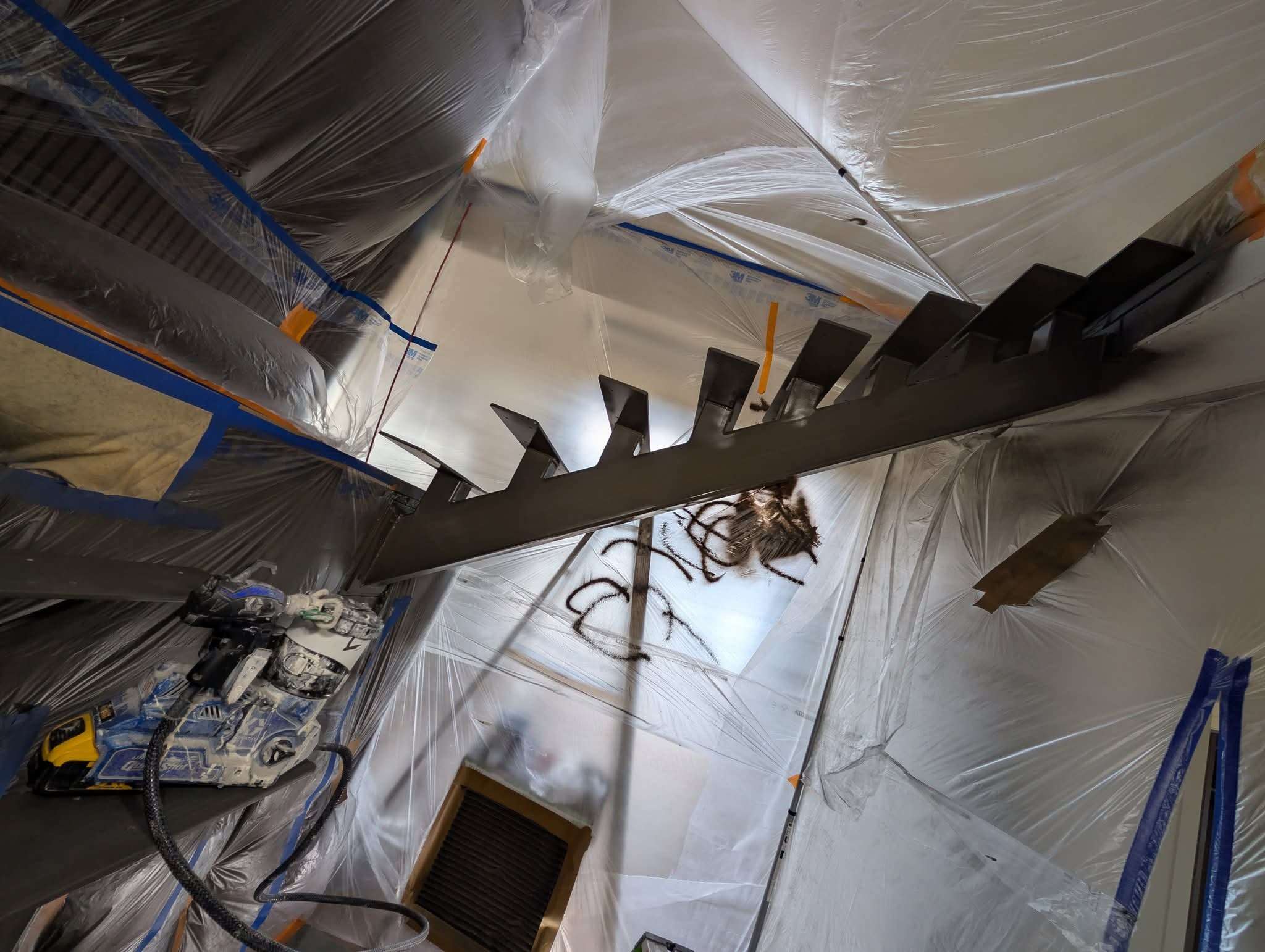Dramatic floating staircase mid-project