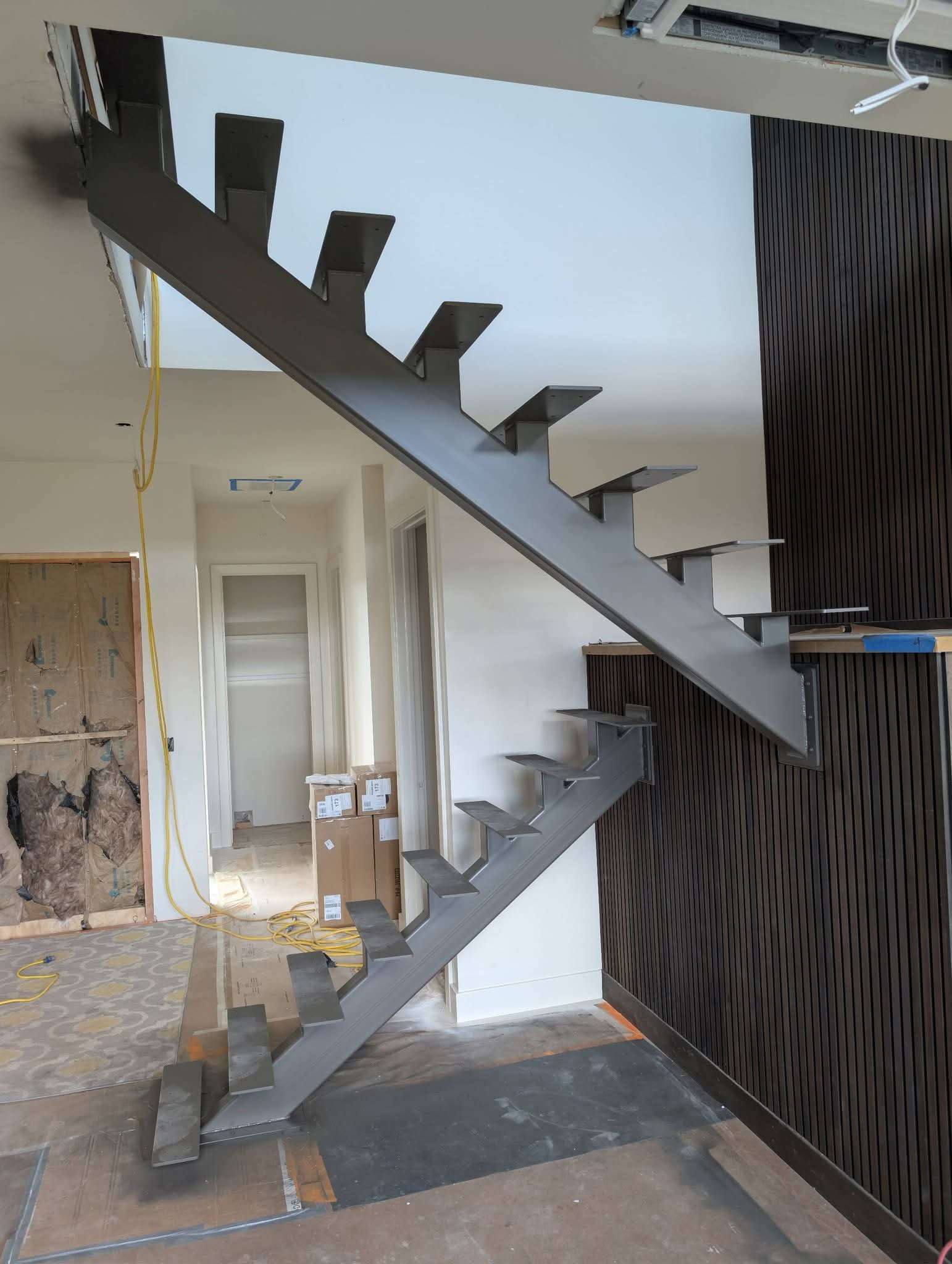 Modern staircase with steel and wood treads